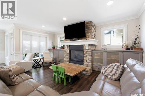 419 Salloum Bay, Saskatoon, SK - Indoor Photo Showing Living Room With Fireplace