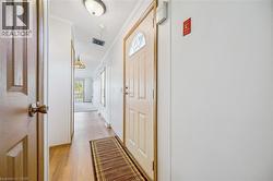 Wood-finish flooring extending through the hallway - 