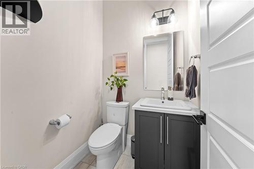 Contemporary vanity featuring a white countertop and dark cabinetry - 130 Pondcliffe Drive, Kitchener, ON - Indoor Photo Showing Bathroom