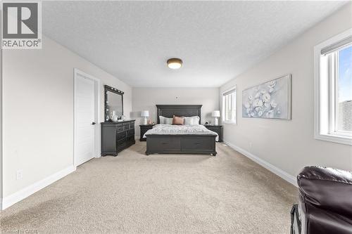 Spacious room featuring neutral carpeting and light-toned walls - 130 Pondcliffe Drive, Kitchener, ON - Indoor Photo Showing Bedroom