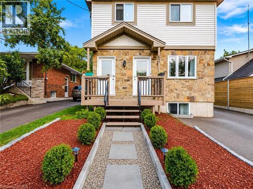 Stone and siding exterior with dual entryways, each featuring a private deck and steps - 67 Kinzie Avenue, Kitchener, ON - Outdoor With Deck Patio Veranda With Facade