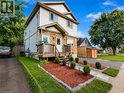 Stone and siding exterior with a front porch - 67 Kinzie Avenue, Kitchener, ON - Outdoor