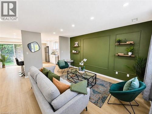 Open-concept living area featuring light wood-finish flooring - 67 Kinzie Avenue, Kitchener, ON - Indoor Photo Showing Other Room