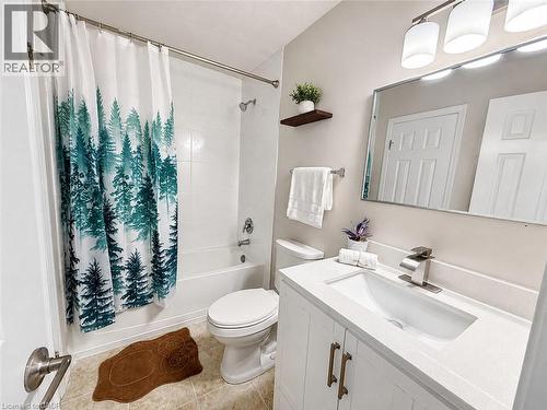 White vanity with bronze hardware, integrated sink, and brushed nickel faucet - 67 Kinzie Avenue, Kitchener, ON - Indoor Photo Showing Bathroom