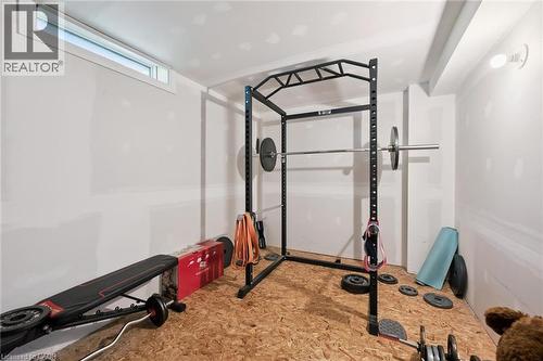 Unfinished lower level space featuring a window, overhead lighting, and OSB subflooring - 589 Elgin Street N, Cambridge, ON - Indoor Photo Showing Gym Room