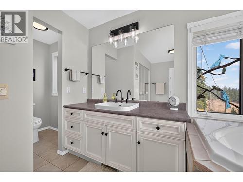 Primary ensuite with soaker tub & a walk-in shower - 3491 Fenton Road, West Kelowna, BC - Indoor Photo Showing Bathroom