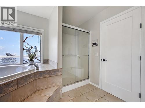 Primary ensuite with soaker tub & a walk-in shower - 3491 Fenton Road, West Kelowna, BC - Indoor Photo Showing Bathroom