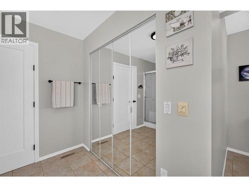 Primary ensuite with soaker tub & a walk-in shower - 3491 Fenton Road, West Kelowna, BC - Indoor Photo Showing Bedroom