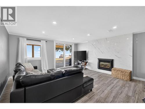 In-law suite living room - 3491 Fenton Road, West Kelowna, BC - Indoor Photo Showing Living Room With Fireplace