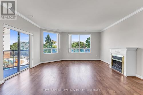 301 - 60 Wyndham Street S, Guelph (St. Patrick'S Ward), ON - Indoor Photo Showing Living Room With Fireplace