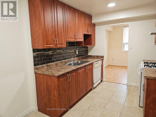104 - 121 Trudelle Drive, Toronto, ON - Indoor Photo Showing Kitchen With Double Sink