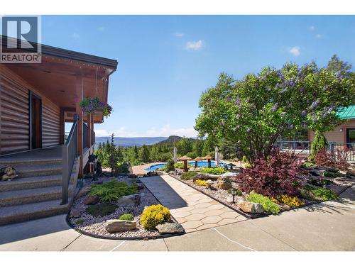 Pathway between leads down to the pool deck - 7319 Trapper Court, Kelowna, BC - Outdoor