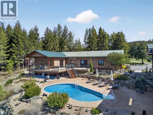 7319 Trapper Court, Kelowna, BC - Outdoor With In Ground Pool With Deck Patio Veranda