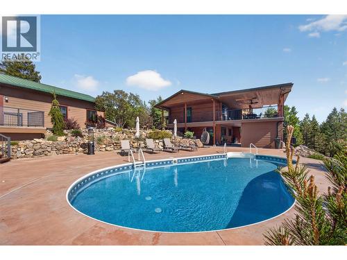 7319 Trapper Court, Kelowna, BC - Outdoor With In Ground Pool With Deck Patio Veranda