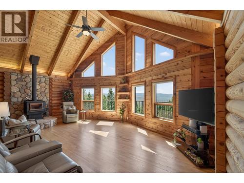 7319 Trapper Court, Kelowna, BC - Indoor Photo Showing Living Room With Fireplace