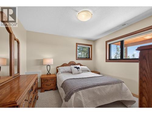 Second bedroom on the lower level - 7319 Trapper Court, Kelowna, BC - Indoor Photo Showing Bedroom