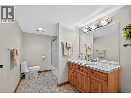 Full bath on the lower level - 7319 Trapper Court, Kelowna, BC - Indoor Photo Showing Bathroom