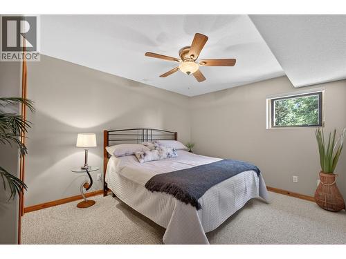 Third bedroom on the lower level - 7319 Trapper Court, Kelowna, BC - Indoor Photo Showing Bedroom