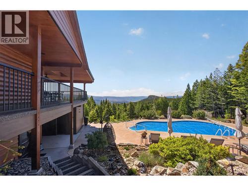7319 Trapper Court, Kelowna, BC - Outdoor With In Ground Pool