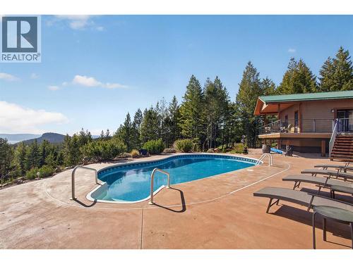 7319 Trapper Court, Kelowna, BC - Outdoor With In Ground Pool With Deck Patio Veranda