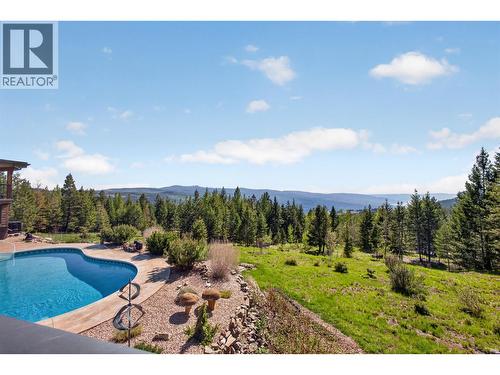 7319 Trapper Court, Kelowna, BC - Outdoor With In Ground Pool With View