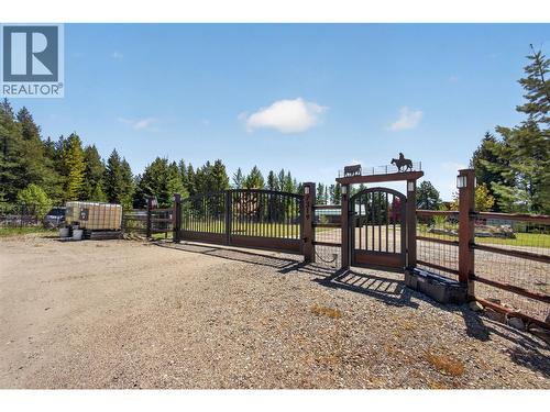 Automatic gate with man door - 7319 Trapper Court, Kelowna, BC - Outdoor