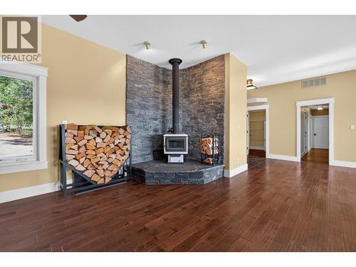 Legal outbuilding with non-conforming kitchen - 7319 Trapper Court, Kelowna, BC - Indoor With Fireplace