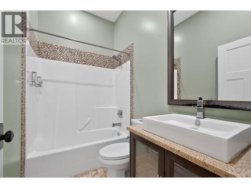 Legal outbuilding with non-conforming kitchen - 7319 Trapper Court, Kelowna, BC - Indoor Photo Showing Bathroom