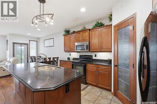 206 Muzyka Road, Saskatoon, SK - Indoor Photo Showing Kitchen With Double Sink