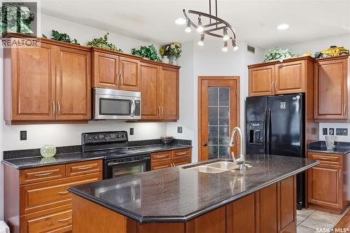 206 Muzyka Road, Saskatoon, SK - Indoor Photo Showing Kitchen With Double Sink