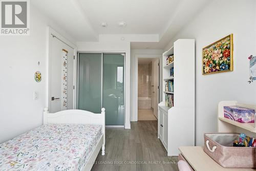 2nd Bed Closet and bath entrance - 503 - 1 Strathgowan Avenue, Toronto, ON - Indoor Photo Showing Bedroom