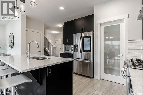 213 Dubois Crescent, Saskatoon, SK - Indoor Photo Showing Kitchen With Stainless Steel Kitchen With Double Sink With Upgraded Kitchen