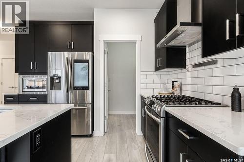 213 Dubois Crescent, Saskatoon, SK - Indoor Photo Showing Kitchen With Stainless Steel Kitchen With Upgraded Kitchen