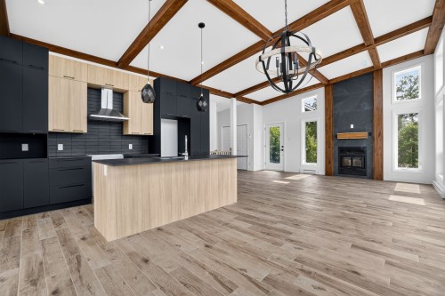 Cuisine - 301 Ch. Du Quartier-Du-Cerf, Saint-Côme, QC - Indoor Photo Showing Kitchen With Fireplace