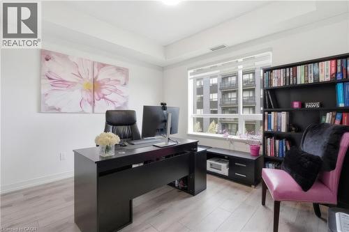 Recessed lighting, wide window, light wood-finish flooring, built-in shelving, and crisp white walls - 251 Northfield Drive E Unit# 312, Waterloo, ON 