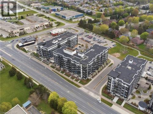 Modern multi-story buildings with dark facades and light trim - 251 Northfield Drive E Unit# 312, Waterloo, ON 
