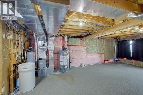 Unfinished basement with exposed wood joists, ceiling-mounted ductwork, and insulation - 193 Mccann Street, Guelph, ON - Indoor Photo Showing Basement
