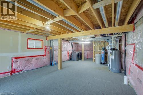 Unfinished basement with exposed ceiling joists, insulation, utility hookups, and a window - 193 Mccann Street, Guelph, ON - Indoor Photo Showing Basement