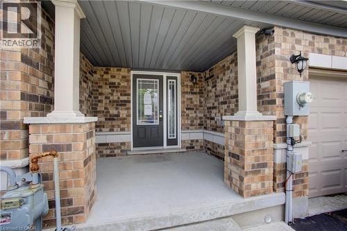 Brick facade with white columns and a covered concrete porch - 193 Mccann Street, Guelph, ON - Outdoor