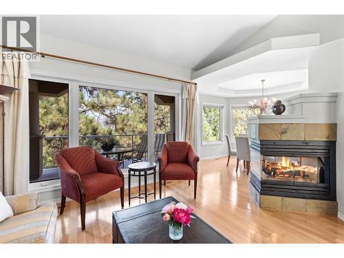 Living room. - 4400 Gallaghers Drive E Unit# 2, Kelowna, BC - Indoor Photo Showing Living Room With Fireplace