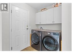 Main floor laundry and entrance to garage. - 