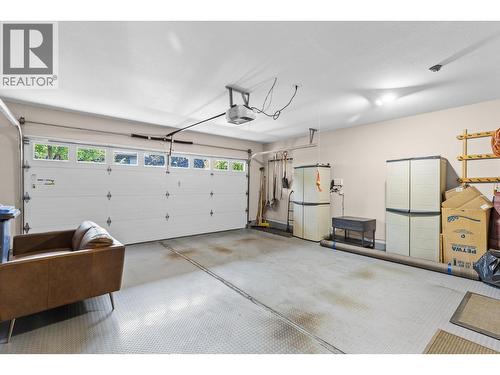 Double car garage. - 4400 Gallaghers Drive E Unit# 2, Kelowna, BC - Indoor Photo Showing Garage