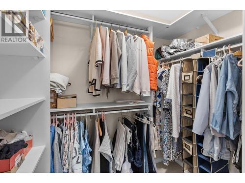 Walk in closet primary bedroom. - 4400 Gallaghers Drive E Unit# 2, Kelowna, BC - Indoor With Storage