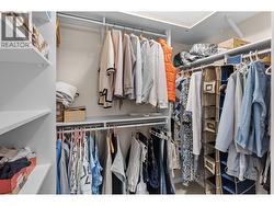 Walk in closet primary bedroom. - 