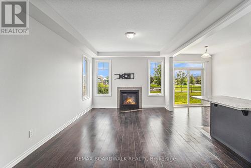 628 Monardia Way, Ottawa, ON - Indoor Photo Showing Living Room With Fireplace