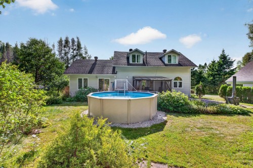 Cour - 205 Rue Des Sources, Saint-Calixte, QC - Outdoor With Above Ground Pool With Backyard With Exterior