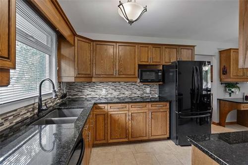 13 Lions Way, Stonewall, MB - Indoor Photo Showing Kitchen With Double Sink