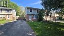 Brick and siding exterior with mature trees - 216 Brunswick Crescent, London, ON 