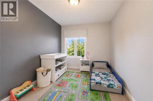 Recessed lighting, window with roller shade, neutral wall tones, and carpeted flooring - 1793 Creek Way, Burlington, ON - Indoor Photo Showing Bedroom
