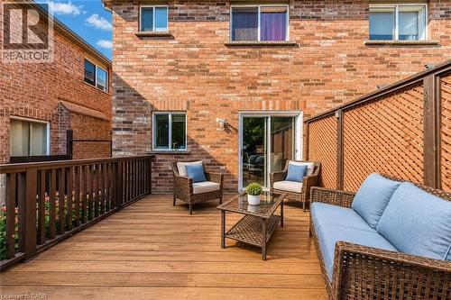Expansive wooden deck with a privacy lattice and direct access to interior via sliding glass doors - 1793 Creek Way, Burlington, ON - Outdoor With Deck Patio Veranda With Exterior